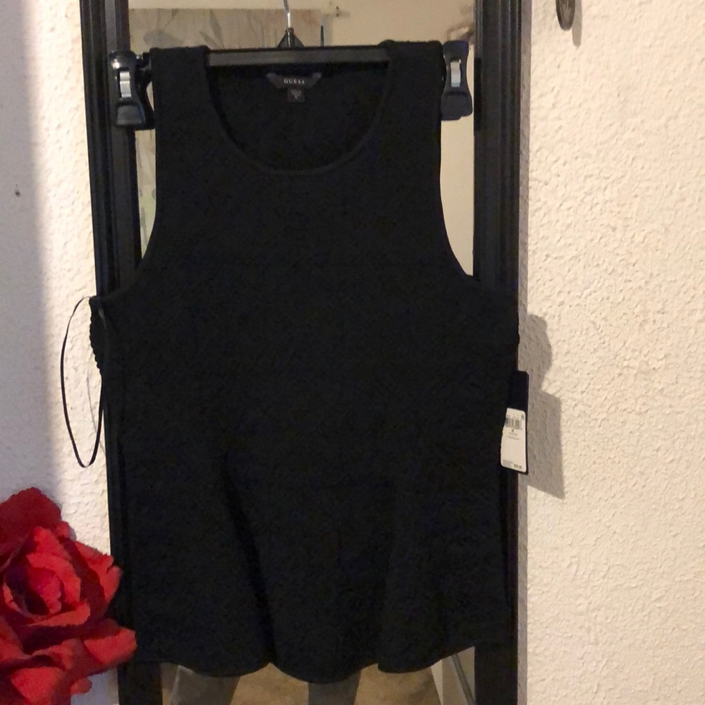 Guess Peplum Geo Stitch top.